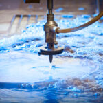 Water-jet,Machine,At,Work,Cutting,A,Steel,Plate.,Detail.
